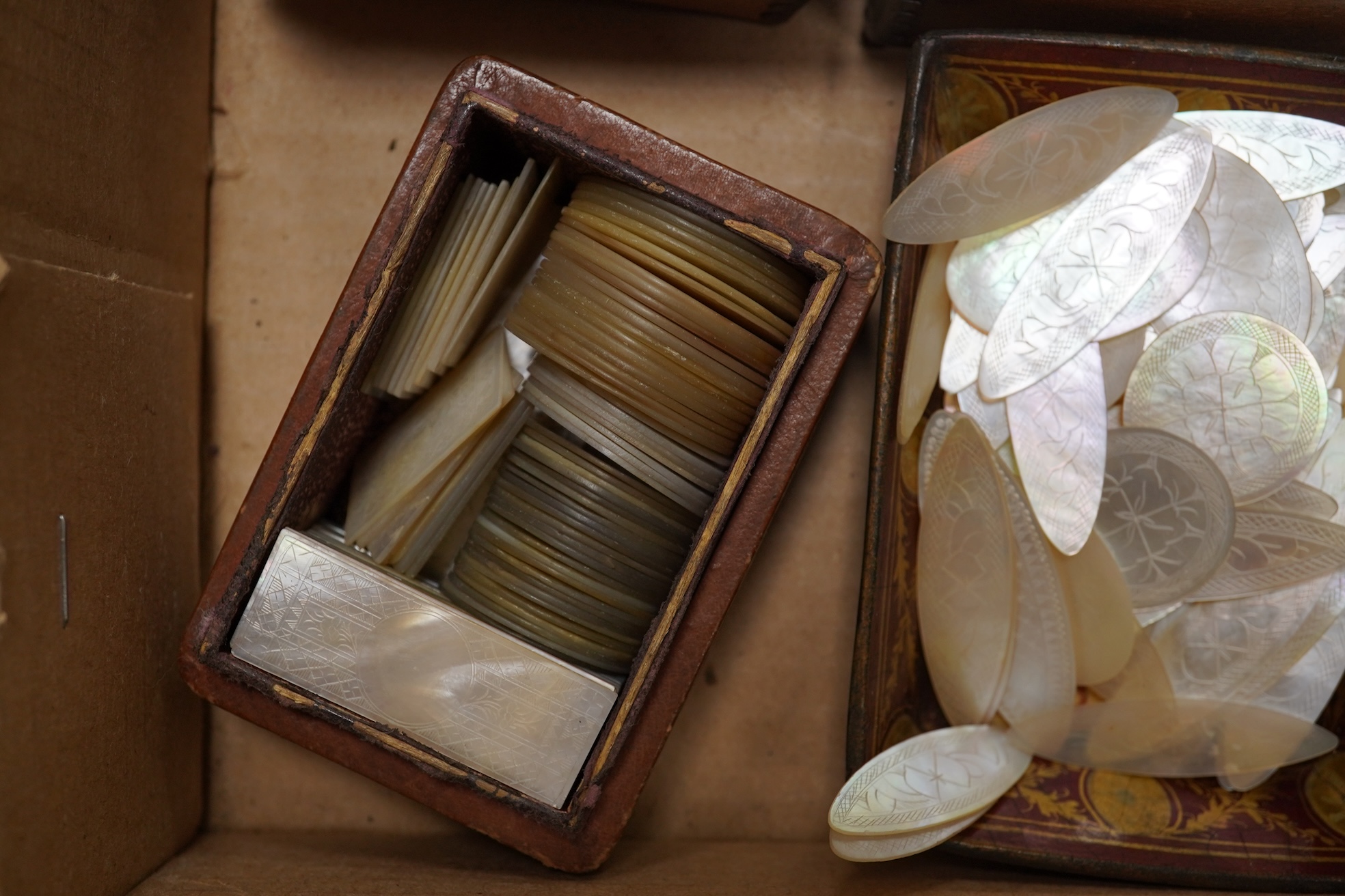 A group of 19th century Chinese mother of pearl gaming counters and accessories, together with a miniature silver cased compass